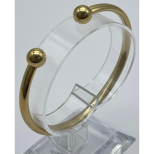 419 - A 9k Yellow Gold All Ended Bangle. 5.7g.