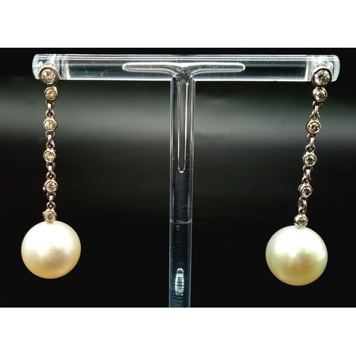 100 - A FABULOUS PAIR OF  PEARL AND DIAMOND DROP EARRINGS . 8.7gms   4cms drop.