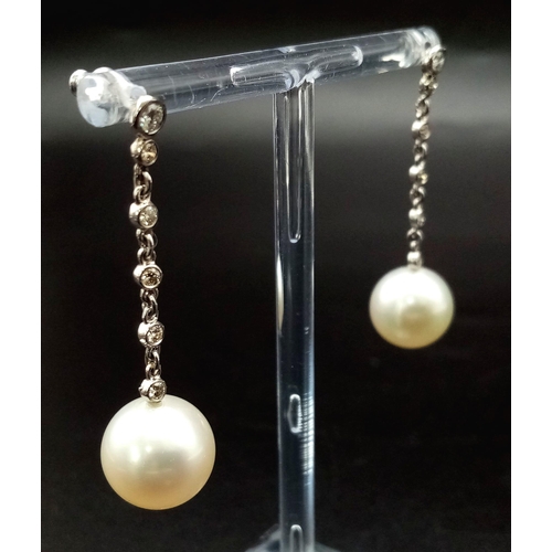 100 - A FABULOUS PAIR OF  PEARL AND DIAMOND DROP EARRINGS . 8.7gms   4cms drop.