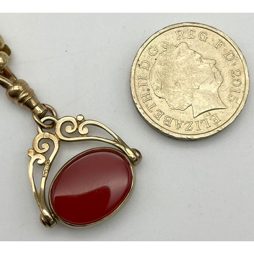 17 - An Antique 9K Gold, Carnelian and Black Onyx Spinning Fob Pendant on a 9K Yellow Gold Chain. 3cm and... 