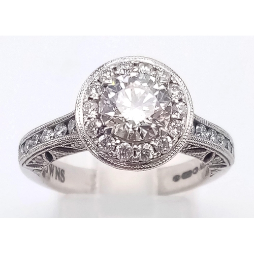 74 - A STUNNING 18K WHITE GOLD DIAMOND RING WITH A BRIGHT CLEAR .8ct CENTRE STONE SURROUNDED BY A HALO OF... 