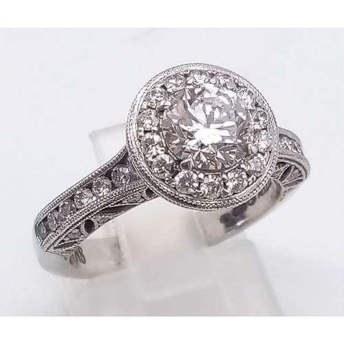 74 - A STUNNING 18K WHITE GOLD DIAMOND RING WITH A BRIGHT CLEAR .8ct CENTRE STONE SURROUNDED BY A HALO OF... 