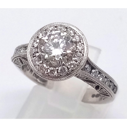 74 - A STUNNING 18K WHITE GOLD DIAMOND RING WITH A BRIGHT CLEAR .8ct CENTRE STONE SURROUNDED BY A HALO OF... 