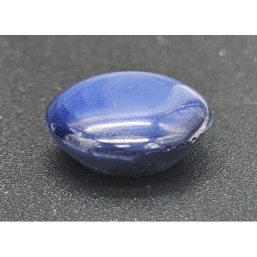 118 - A spectacular, blue STAR SAPPHIRE. Good size (10.50 carats), round cabochon (diameter: 13 mm). Due t... 