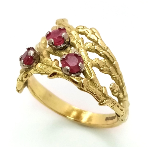 142 - A Vintage 18K Yellow Gold and Ruby Ring. Foilage decoration with three rubies. Size K. 4.3g total we... 