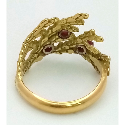 142 - A Vintage 18K Yellow Gold and Ruby Ring. Foilage decoration with three rubies. Size K. 4.3g total we... 