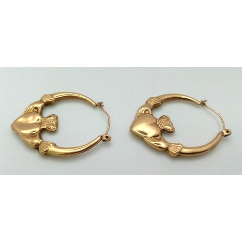 1615 - A Pair of Vintage 9K Yellow Gold Claddagh Hoop Earrings.
1.75g total weight.