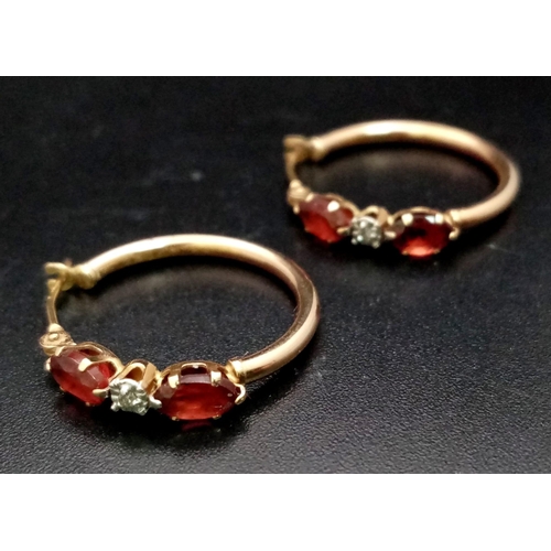 1625 - A Pair of 9K Yellow Gold Garnet Hoop Earrings. 1.25g total weight.