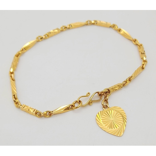 107 - A 22K Yellow Gold Bar-Link Bracelet with Heart Charm. 16cm
7.68g