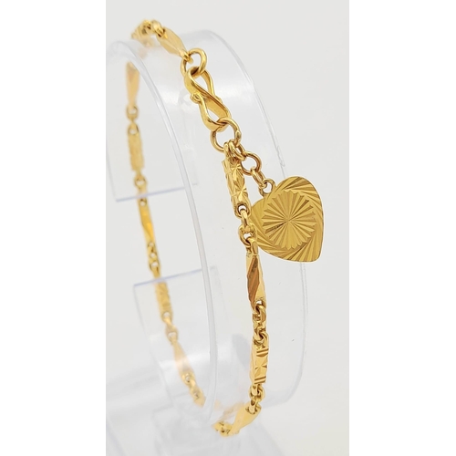 107 - A 22K Yellow Gold Bar-Link Bracelet with Heart Charm. 16cm
7.68g