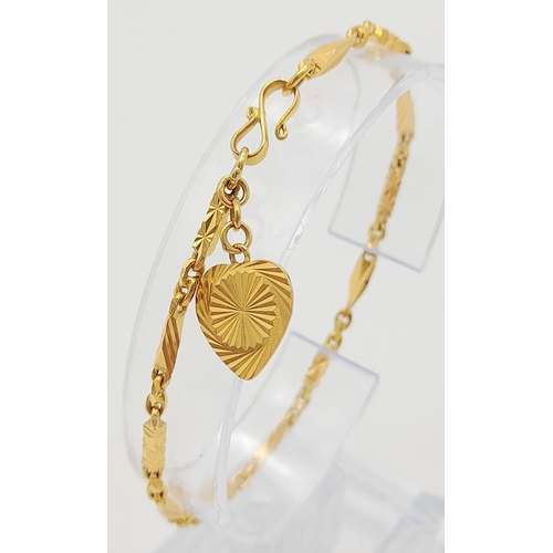 107 - A 22K Yellow Gold Bar-Link Bracelet with Heart Charm. 16cm
7.68g