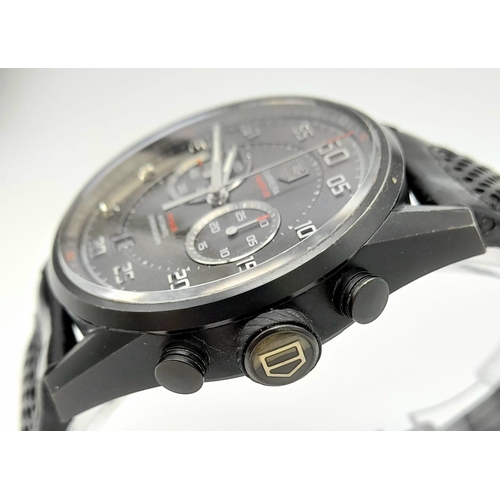 25 - A Tag Heuer Carrera Flyback Automatic Chronograph Gents Watch. Black leather/rubber strap. Case - 44... 