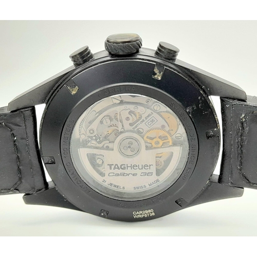 25 - A Tag Heuer Carrera Flyback Automatic Chronograph Gents Watch. Black leather/rubber strap. Case - 44... 