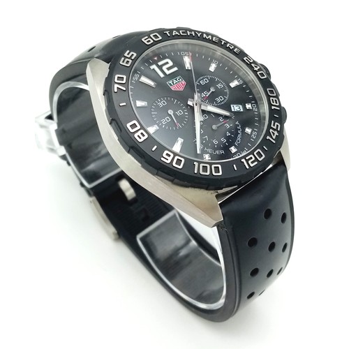 50 - A Tag Heuer Formula Gents Chronograph Watch. Black rubber strap. Black dial with three sub dials. Qu... 