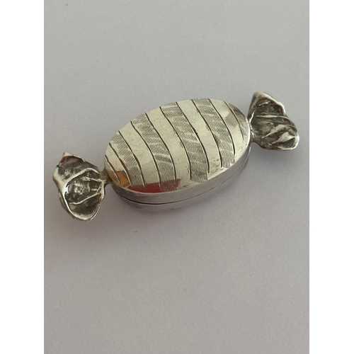 119 - Vintage Rare and unusual SILVER PILL BOX in the form of a wrapped toffee. Having full UK hallmark.