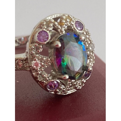 329 - SILVER and MYSTIC QUARTZ RING, Having beautiful oval cut stone set to top with Sapphire and Topaz su... 