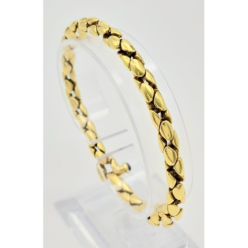 347 - An 18K Yellow Gold Reptilian Link Bracelet. Sapphire decorated clasp. 20cm. 19.05g. Ref: 12812