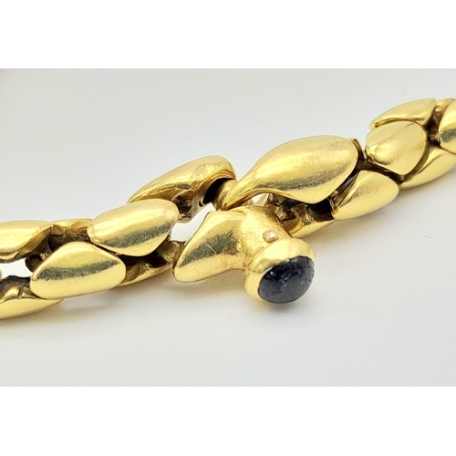 347 - An 18K Yellow Gold Reptilian Link Bracelet. Sapphire decorated clasp. 20cm. 19.05g. Ref: 12812