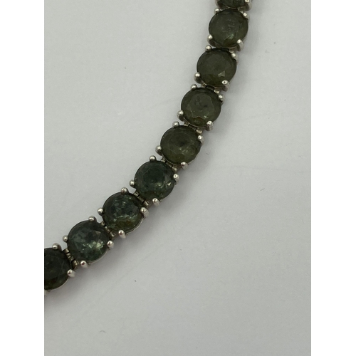 42 - SILVER and GREEN DIOPSIDE TENNIS BRACELET by TI SENTO of  MILAN ITALY. Having 28 gemstones set indiv... 