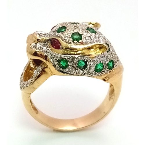 61 - An 18 k yellow gold Panther ring with diamonds and emeralds and two ruby eyes. Ring size: K, weight:... 