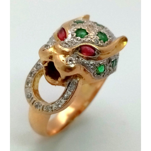 61 - An 18 k yellow gold Panther ring with diamonds and emeralds and two ruby eyes. Ring size: K, weight:... 