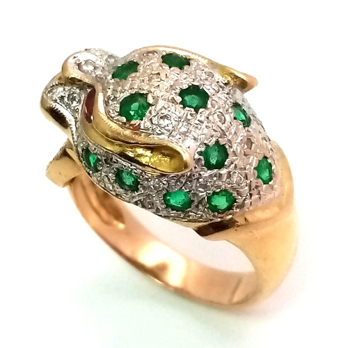 61 - An 18 k yellow gold Panther ring with diamonds and emeralds and two ruby eyes. Ring size: K, weight:... 