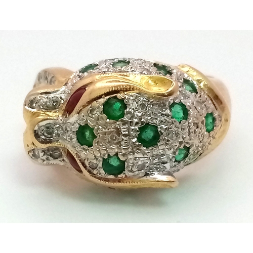 61 - An 18 k yellow gold Panther ring with diamonds and emeralds and two ruby eyes. Ring size: K, weight:... 