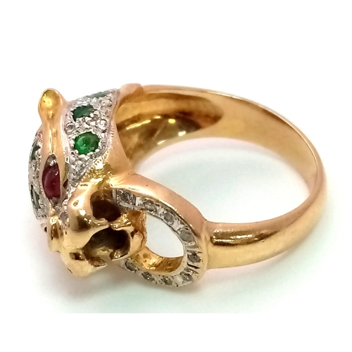 61 - An 18 k yellow gold Panther ring with diamonds and emeralds and two ruby eyes. Ring size: K, weight:... 