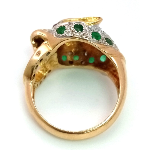 61 - An 18 k yellow gold Panther ring with diamonds and emeralds and two ruby eyes. Ring size: K, weight:... 