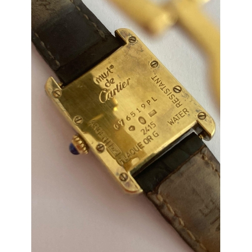 84 - Ladies vintage CARTIER TANK MUST 2415 Wristwatch. Serial number 076519PL. Finished in 18 carat GOLD ... 