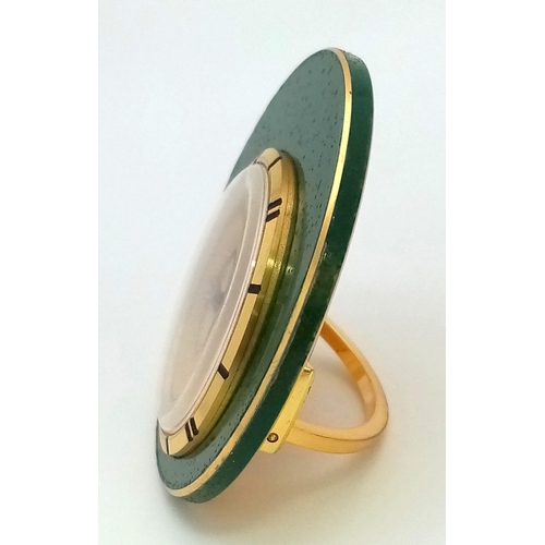 85 - A Vintage Jaeger le Coultre Travel Alarm Clock. Green enamel outer. Gilded dial with date window. 47... 