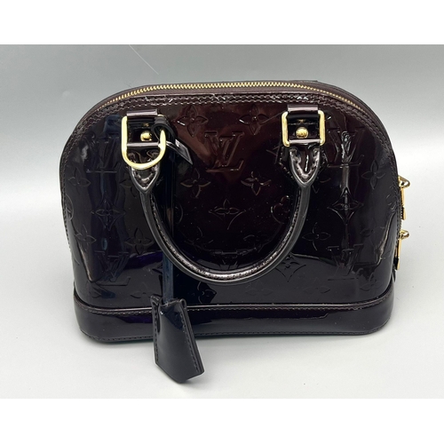 73 - A Louis Vuitton Burgundy Patent Leather Handbag. Monogram LV patent leather, gold-tone hardware. Sho... 