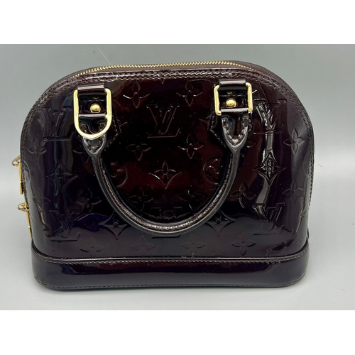 73 - A Louis Vuitton Burgundy Patent Leather Handbag. Monogram LV patent leather, gold-tone hardware. Sho... 