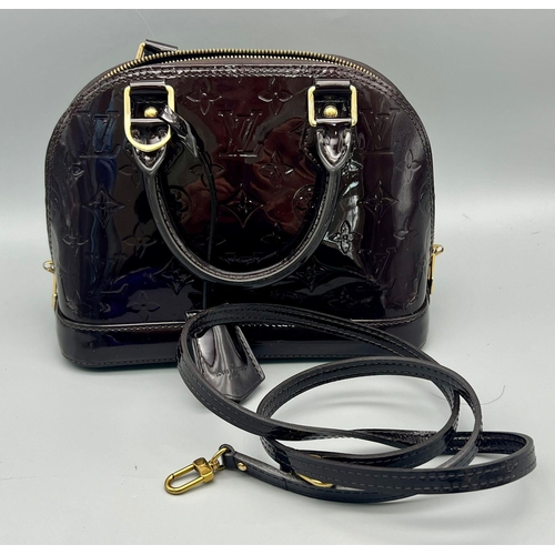 73 - A Louis Vuitton Burgundy Patent Leather Handbag. Monogram LV patent leather, gold-tone hardware. Sho... 