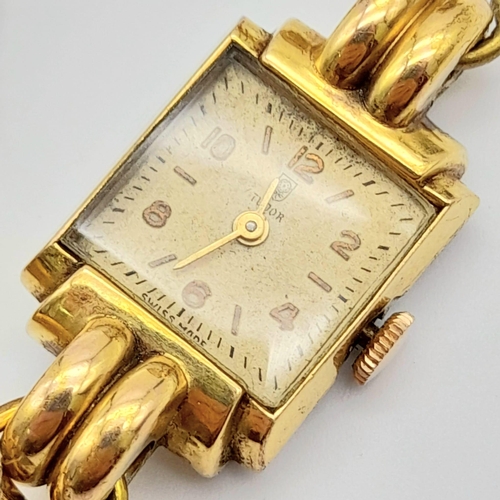 86 - A Vintage Tudor (Rolex) Ladies Watch. Gold plated bracelet. Small rectangular case - 16 x 22mm. Whit... 