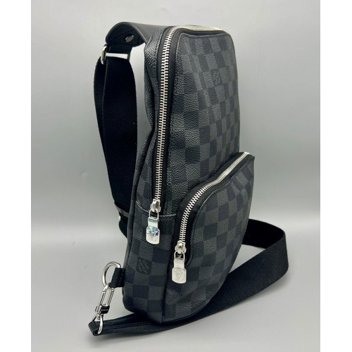 127 - A Louis Vuitton Checked Canvas Messenger Bag. Silver-tone hardware. Zipped outer compartment. Adjust... 