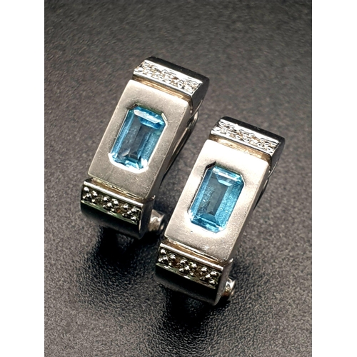 155 - A 14 K white gold pair of earrings with diamonds and either blue topaz or aquamarine.  Weight: 6.1 g... 