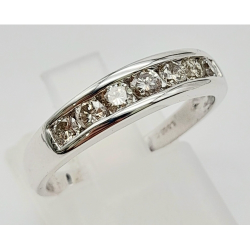 176 - An 18 K yellow gold ring with a channel set band of diamonds (0.25 carats). Ring size: N, weight: 3.... 