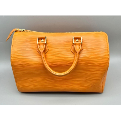 177 - A Louis Vuitton Mandarin Epi Leather Speedy Bag. Twin handles with a zipped top. Orange textile inte... 