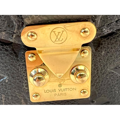 18 - A Louis Vuitton Pochette Metis Leather Bag. Black monogram empreinte leather. Zipped exterior compar... 