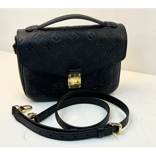 18 - A Louis Vuitton Pochette Metis Leather Bag. Black monogram empreinte leather. Zipped exterior compar... 