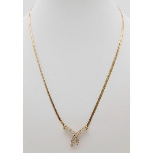 148 - An 18 k yellow gold, diamond (0.45 carats) set chain necklace. Length: 41 cm, weight: 5.4 g.