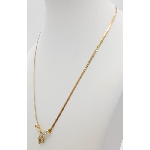 148 - An 18 k yellow gold, diamond (0.45 carats) set chain necklace. Length: 41 cm, weight: 5.4 g.