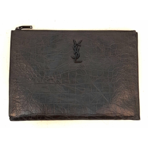 326 - An Yves Saint Laurent (YSL) Black Leather Pouch. Initials on exterior. Cloth interior with multiple ... 