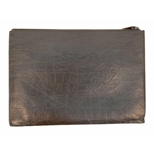 326 - An Yves Saint Laurent (YSL) Black Leather Pouch. Initials on exterior. Cloth interior with multiple ... 