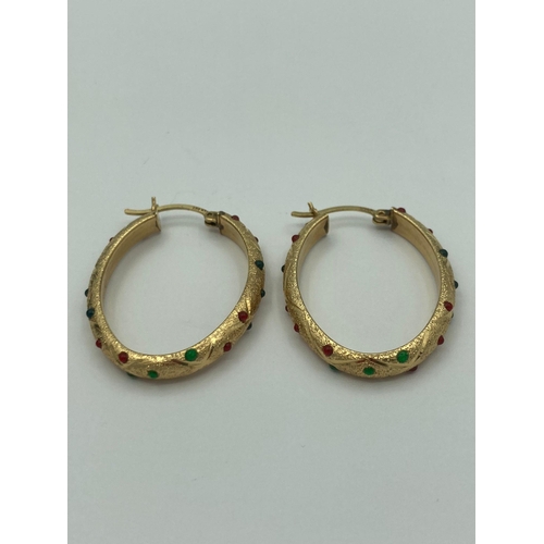 77 - Pair of beautiful oval hoop 14 carat GOLD EARRINGS set with coloured gemstones. 5.2g