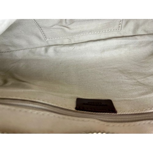 129 - A Burberry Baguette Pouch Bag. Exterior beige canvas with leather handle and trim. Textile interior ... 