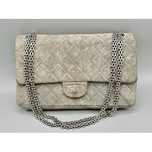 11 - A Classic Chanel Grey Suede Quilted Large Shoulder Flap Bag. Quilted soft suede exterior (worn). Gre... 