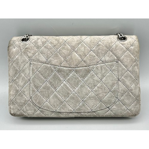 11 - A Classic Chanel Grey Suede Quilted Large Shoulder Flap Bag. Quilted soft suede exterior (worn). Gre... 