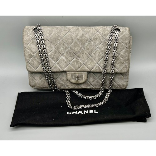 11 - A Classic Chanel Grey Suede Quilted Large Shoulder Flap Bag. Quilted soft suede exterior (worn). Gre... 